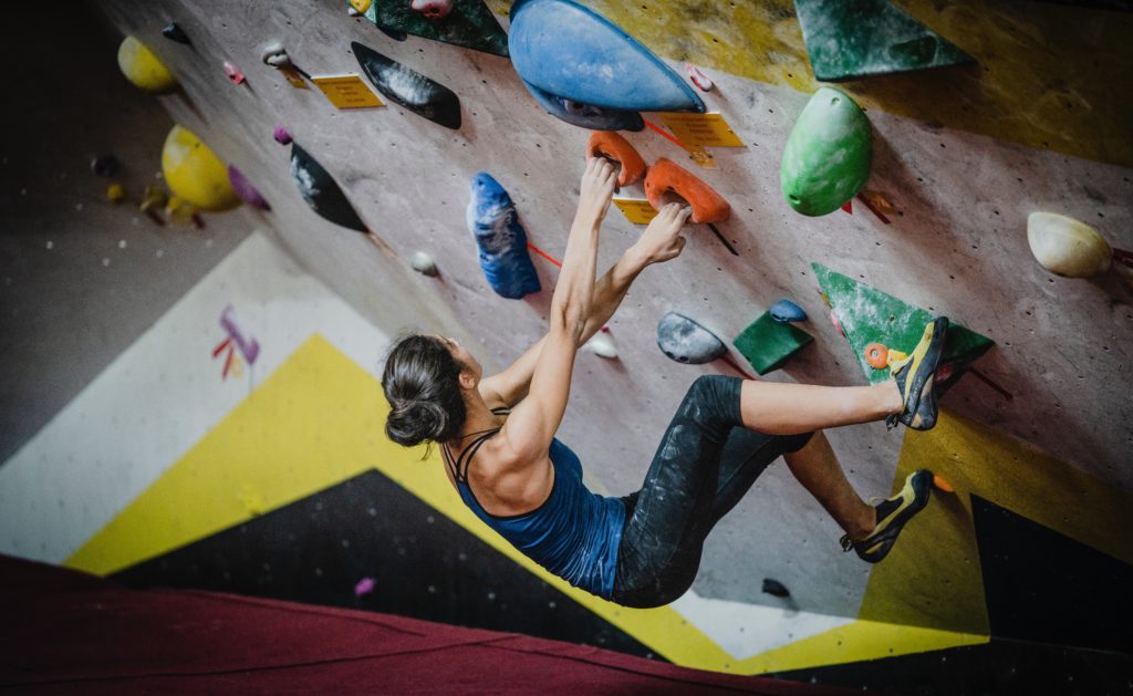 A woman indoor rock climbing